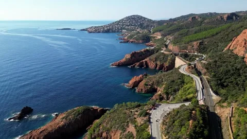 View of Esterel Mountains and winding road above the blue Mediterranean Sea Stock Footage 319550077