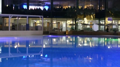 View on evening pool yard in luxury hotel. low lights 스톡 동영상 163079386