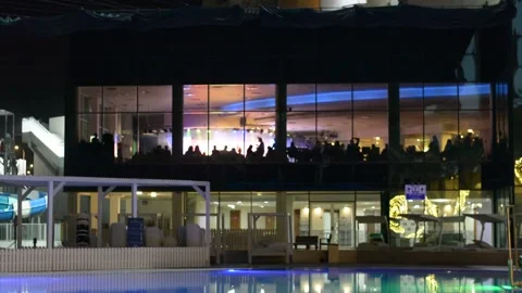 View on evening pool yard in luxury hotel. low lights 스톡 동영상 163079476