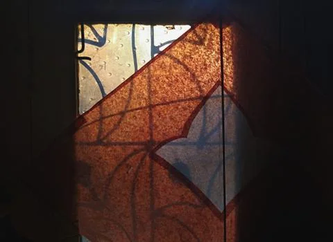 View of evening sun rays on a dusty window Stock Photos