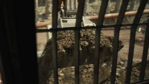 View from Excavator Cab During Earthmoving Operations at Construction Site Stock Footage 336131473