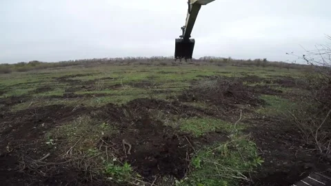 View from the excavator while loading the dump truck with tree branches Stock Footage 158687007