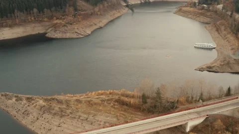 View of an excursion boat and a bridge at the edge of a dam in Germany Stock Footage 143592796
