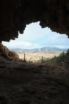 View of the exit from the cave in the mountains 스톡 사진