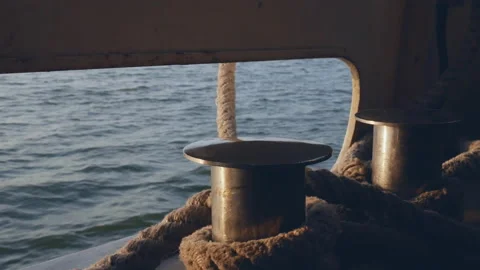 View of the expanse of the sea from a moving ship through a mooring deck bollard Stock Footage 121306841