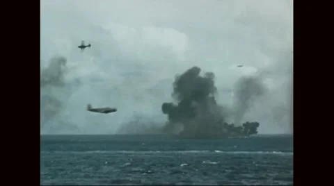 View of explosions and Navy aircrafts flying over North Pacific ocean Stock Footage