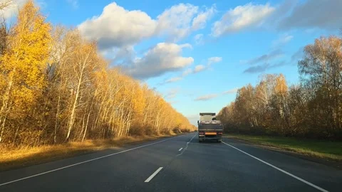 View of the expressway from the car window asphalt pavement dividing strip Stock Footage 289247153