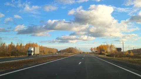 View of the expressway from the car window asphalt pavement dividing strip Stock Footage 289247446