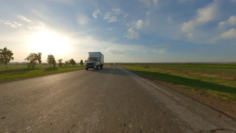 View of the expressway in the suburban area. A small car with cargo passes at Stock Footage 154790164
