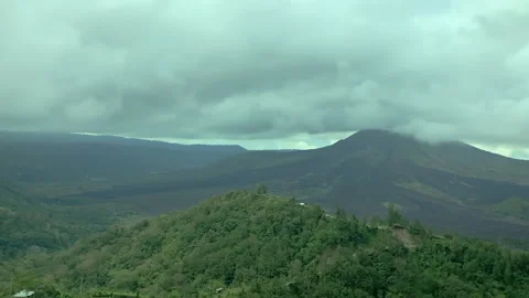 View of an extinct volcano that is covered by thick clouds. Stock Footage 154451773