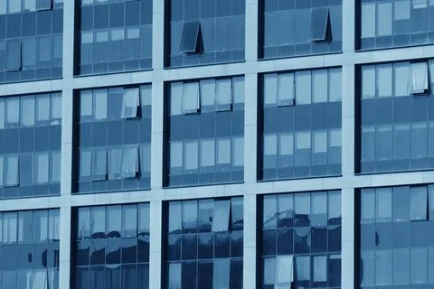 View of the facade of a building with large windows. Stock Photos