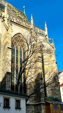 View of the facade of the Catholic Cathedral in the rays of the setting sun Stock Photos