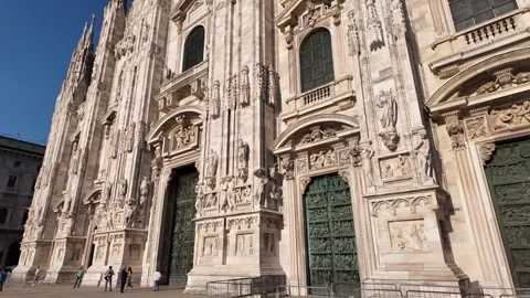 View of the facade of the Duomo and the large entrance door Stock Footage 314583936