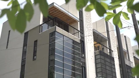 View of the facade of a newly built modern multi-storey residential building. Stock Footage 221148733