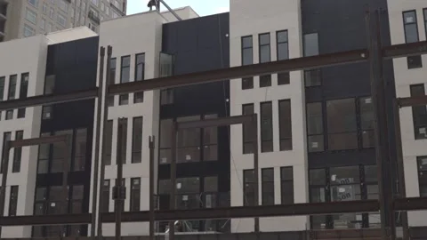 View of the facade of a newly built modern multi-storey residential building. Stock Footage 221148735