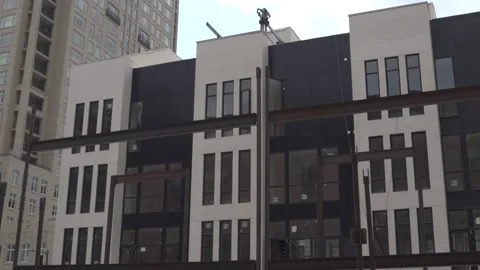 View of the facade of a newly built modern multi-storey residential building. Stock Footage 221148740