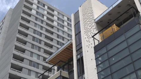 View of the facade of a newly built modern multi-storey residential building. Stock Footage 221148753