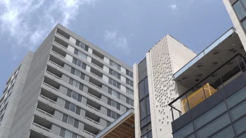 View of the facade of a newly built modern multi-storey residential building. Stock Footage 221148770