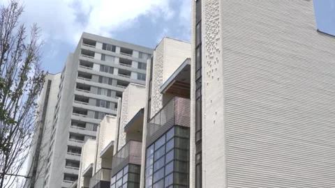 View of the facade of a newly built modern multi-storey residential building. Stock Footage 221148773