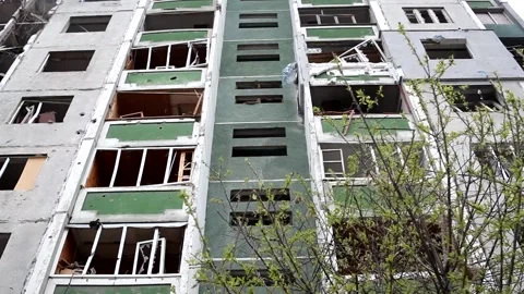 View of the facade of the residential building destroyed after the bombing city. Stock Footage 194363776