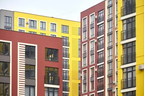 View of the facades of multi-colored multi-storey residential buildings. Frag Stock Photos
