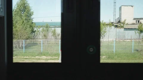 View of factory areas from window of moving train. Slow motion view Stock Footage 115069322