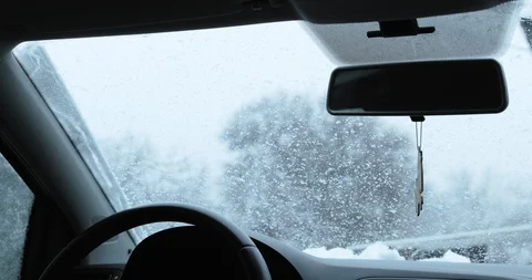 View Of The Falling Snow On A Car Windshield Stock Footage 124624921