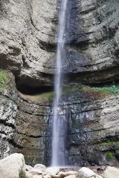 View of a falling waterfall in the Caucasus Mountains Stock Photos