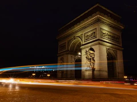 View of famous Arc de Triomphe in Charles de Gaulle square at night in Paris, Stock-Fotos