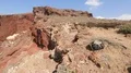 View of famous beach with unique landscape of red and black volcanic rocks HD Footage