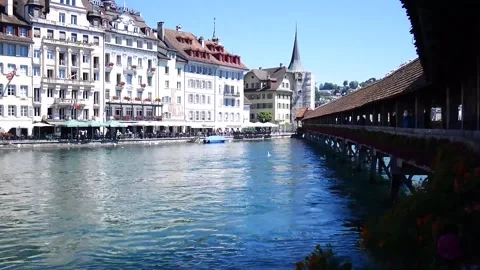 View of famous Chapel Bridge in Lucerne and the backgroud historical building Stock Footage 164515249