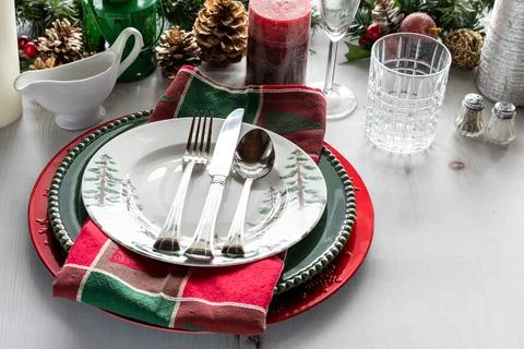 A view of a fancy holiday table setting with decorations. Stock Photos