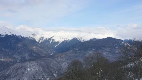 View far from rocky mountains covered with snow Stock Footage 71826666