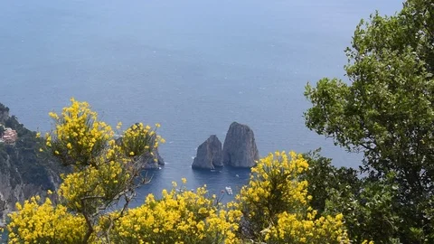 A view of the Faraglioni rock formations in Capri Stock Footage 119330428