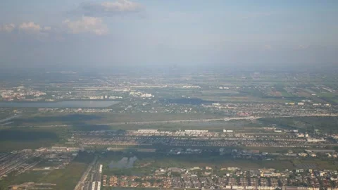 View of farm field while flying over fluffy cloud sky scape in daytime ,Aer.. Stock Footage 256116936