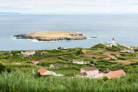 View of the Farol da Ponta do Topo and Ilhéu do Topo Stock Photos