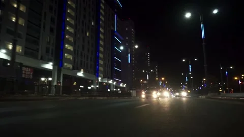 View of fast car moving on a night avenue in city, road with lights reflected on 動画素材 133203487