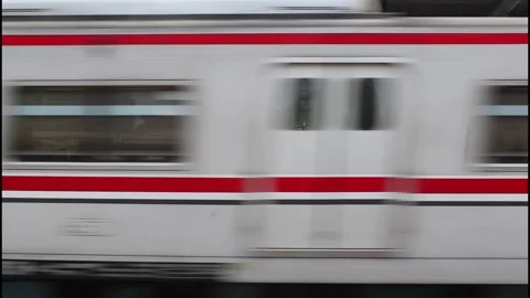 View of fast moving of a passenger train at Jakarta Station Stock Footage 339934382