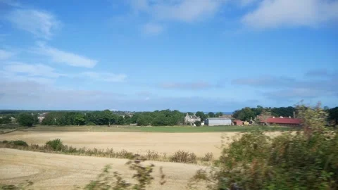 View from a Fast Moving Train to the Fields in the European Countryside Stock Footage 244815859