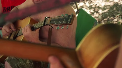 VIew of fat man's body playing the guitar. Man's leisure. Stock Footage 138314671