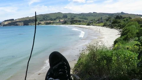 View of the feet, legs facing the Karitane Beach in Dunedin, New Zealand. Stock Footage 120677413