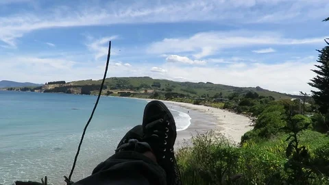 View of the feet, legs facing the Karitane Beach in Dunedin, New Zealand. Stock Footage 120678331
