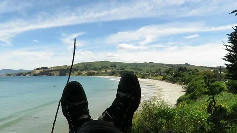 View of the feet, legs facing the Karitane Beach in Dunedin, New Zealand. Stock Footage 120678912