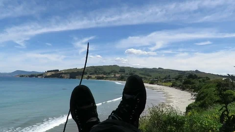 View of the feet, legs facing the Karitane Beach in Dunedin, New Zealand. Stock Footage 120679251