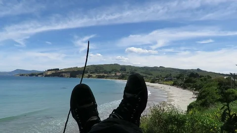 View of the feet, legs facing the Karitane Beach in Dunedin, New Zealand. Stock Footage 120679360