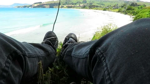 View of the feet, legs facing the Karitane Beach in Dunedin, New Zealand. Stock Footage 120679550