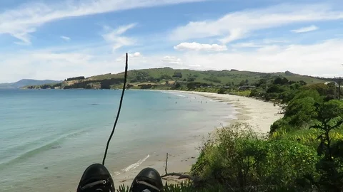 View of the feet, legs facing the Karitane Beach in Dunedin, New Zealand. Stock Footage 120679743