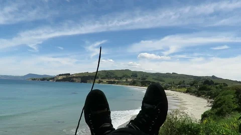 View of the feet, legs facing the Karitane Beach in Dunedin, New Zealand. Stock Footage 120680336