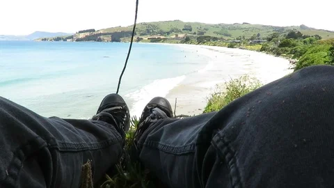 View of the feet, legs facing the Karitane Beach in Dunedin, New Zealand. Stock Footage 120680893