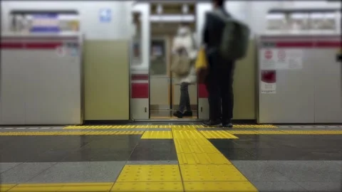 View feet of passenger while get into the train-subway commuter in rush hour Stock Footage 153477210